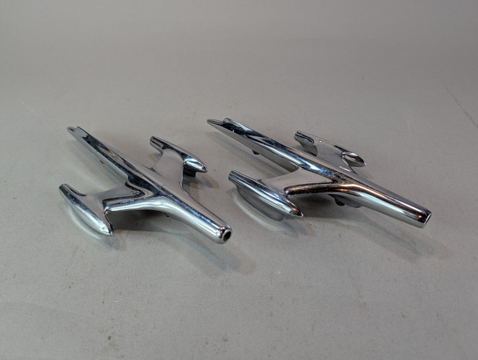 1957 Oldsmobile Chrome Fender Ornament Jet Rocket Pair Super 88 Models LOT