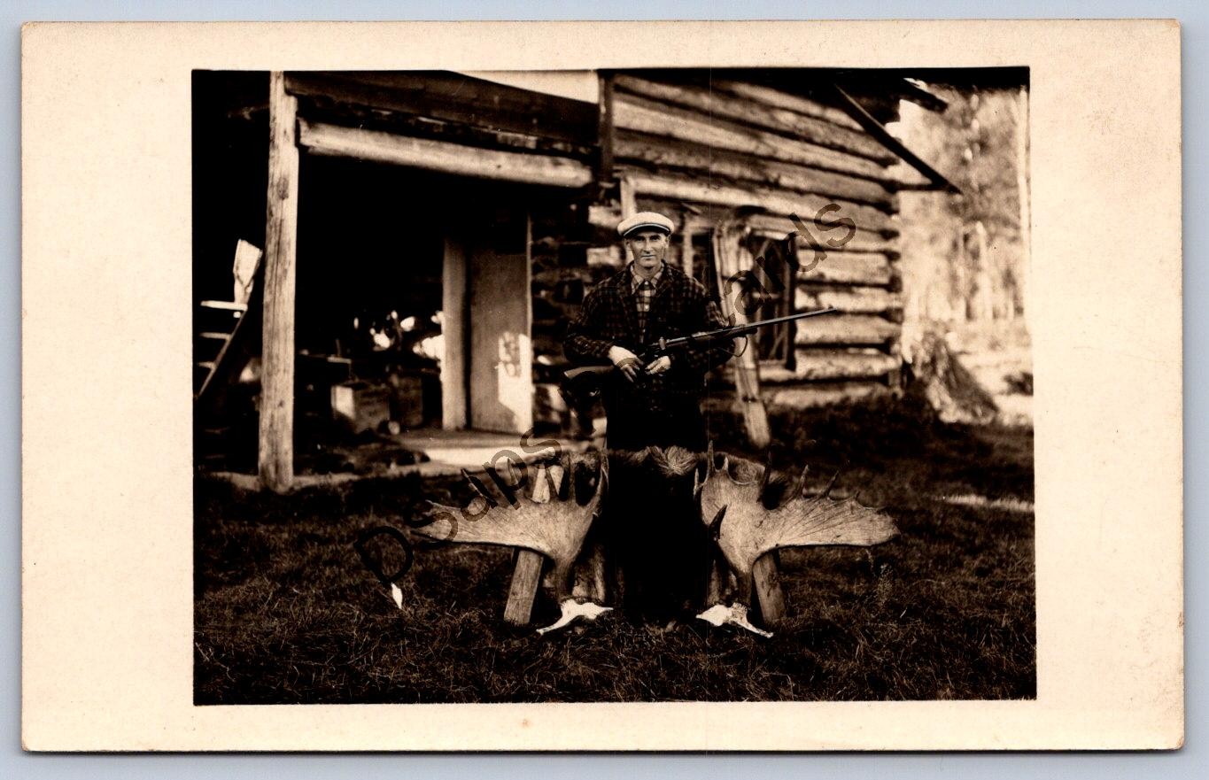 K57/ Interesting RPPC Postcard c1910 Man Log Cabin moose Hunting Rifle 344