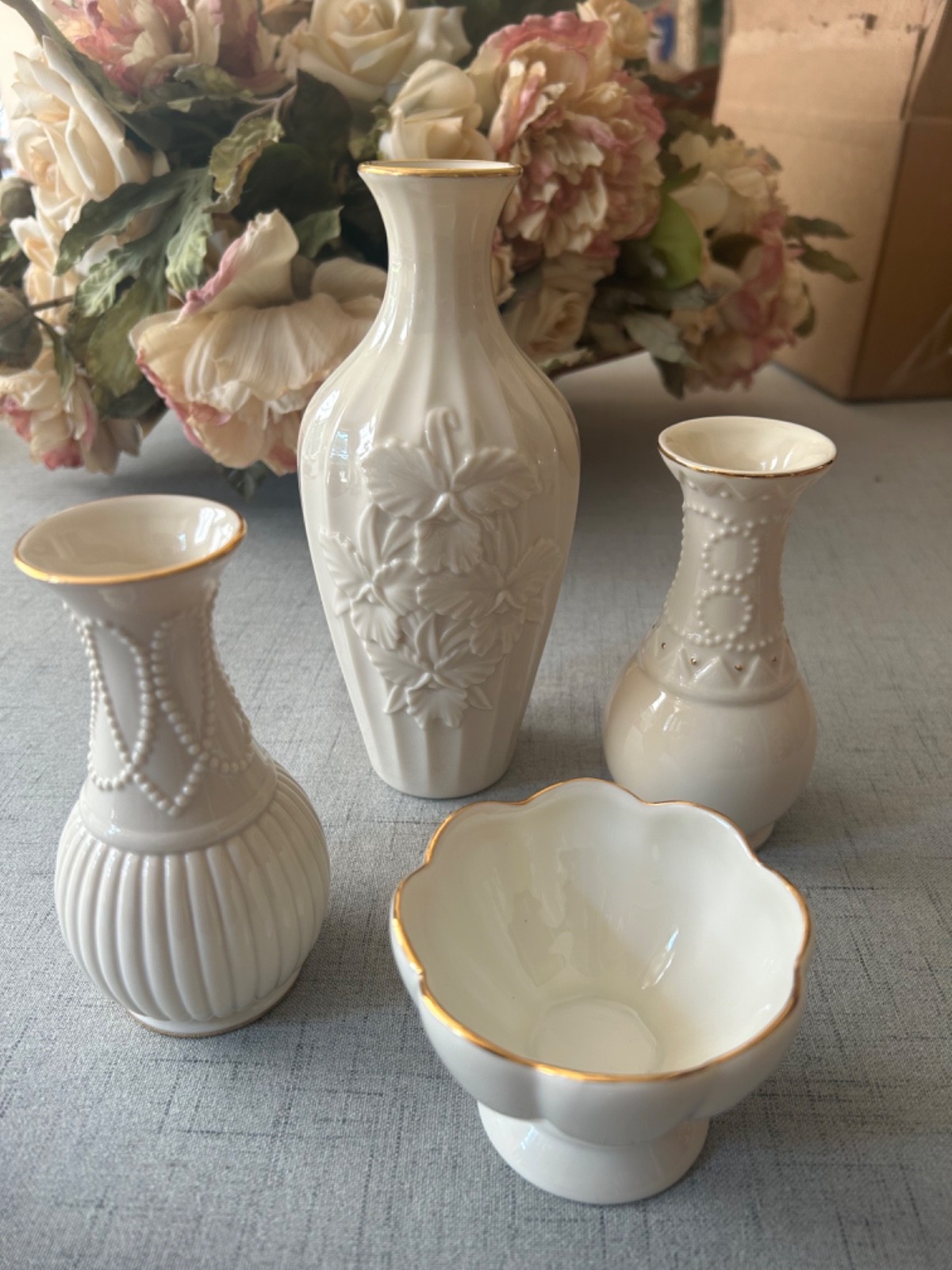 4 Lenox items:  3 Lenox bud vases, 1 compote.  Ivory with gold accents.