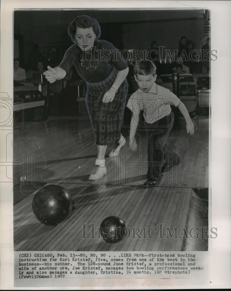 1957 Press Photo bowling professional June Kristof shows her son how to bowl, IL