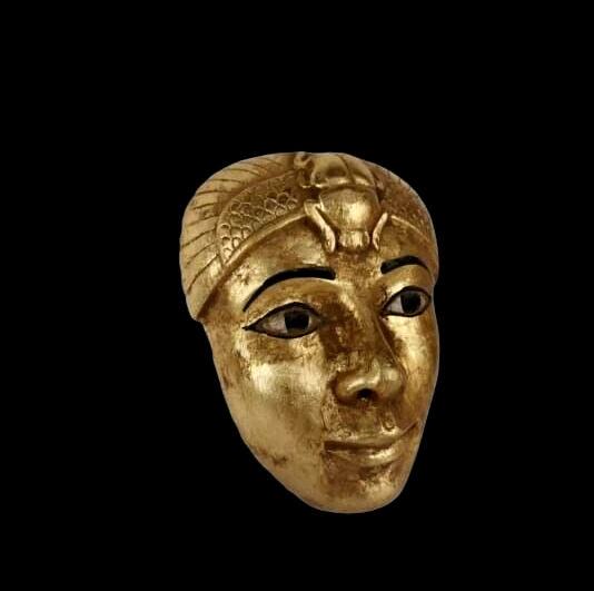 A rare ancient Egyptian gold mask with a Pharaonic scarab beetle statue, BC