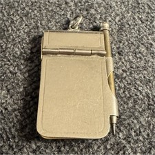 This is an antique aide-mémoire, a miniature notepad and pencil set picture