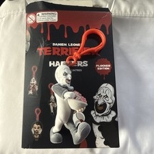 UCC Distributing Damien Leone's Terrifier Art The Clown Flocked Edition Hanger. picture
