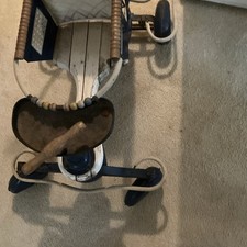 An Antique Baby Stroller with Wheels picture
