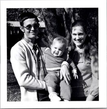 Smiling Young Family with Baby Outdoors, 1970s B&W Snapshot Photo picture