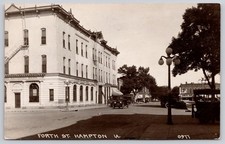 Fourth Street Hampton Iowa IA Bank Hotel Cars RPPC Postcard c1920s picture