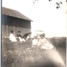 c1910s Outdoor Picnic RPPC Postcard People On Grass Barn Parasol Sun Umbrella picture